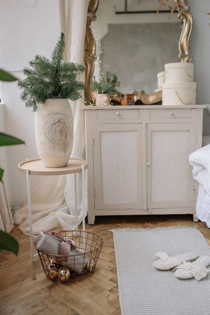 Stylish bedroom interior with a dresser, elegant decor, and cozy elements.