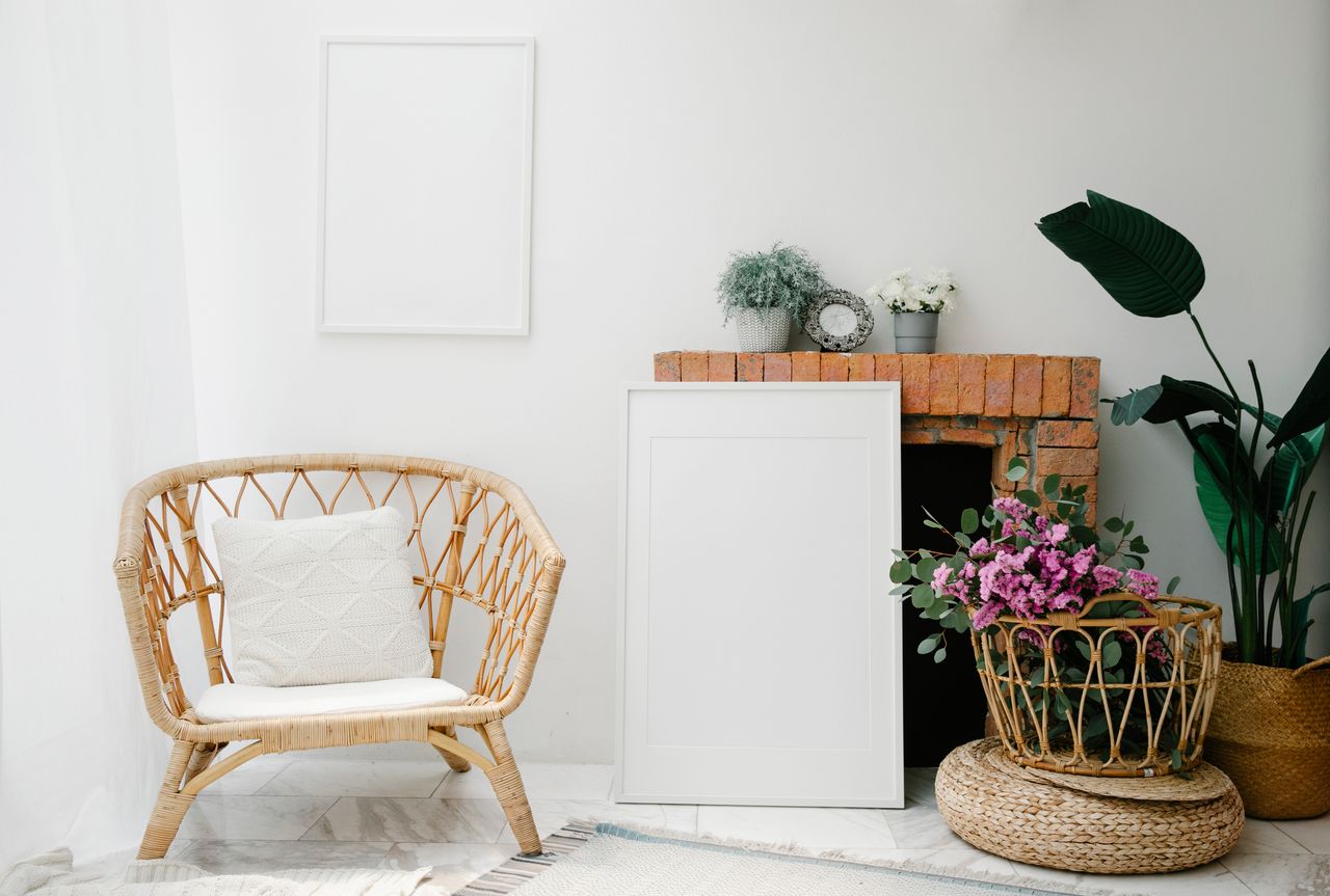 Beautiful minimalist living room with wicker furniture and floral decor, perfect for stylish homes.